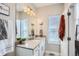 Well-lit bathroom with a large mirror, spacious vanity, and natural light, creating a bright and functional space at 5676 Emporia St, Denver, CO 80238