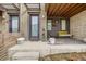 Inviting front porch with a comfortable seating area, stylish decor, and a welcoming entrance at 5676 Emporia St, Denver, CO 80238