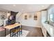 Spacious kitchen with white cabinets, modern appliances, and an island that connects to the living area at 5676 Emporia St, Denver, CO 80238