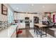 Modern kitchen with sleek countertops, stainless steel appliances, and a seamless connection to the living area at 5676 Emporia St, Denver, CO 80238