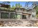 Exterior of home with a three-car garage with matching green doors and stone accents at 7317 Fremont Pl, Larkspur, CO 80118