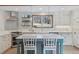 Charming kitchen featuring an island, stainless steel appliances, and a window above the sink at 7317 Fremont Pl, Larkspur, CO 80118