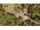 Aerial view of the house and surrounding wooded area, highlighting the privacy and seclusion of the property at 3251 Interlocken Dr, Evergreen, CO 80439