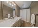 Bathroom featuring a white sink with tile countertop, a toilet, and a shower with a white curtain at 3251 Interlocken Dr, Evergreen, CO 80439