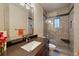 Bathroom featuring modern sink and glass shower with unique patterned tile at 3251 Interlocken Dr, Evergreen, CO 80439