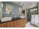 Bathroom featuring dual sinks, modern lighting, and bright lighting at 3251 Interlocken Dr, Evergreen, CO 80439
