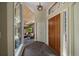 Grand entryway with hardwood door, stone floors, and living room view at 3251 Interlocken Dr, Evergreen, CO 80439