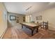 Game room featuring a pool table, comfortable seating, and classic wall art at 3251 Interlocken Dr, Evergreen, CO 80439