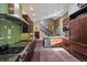 Spacious kitchen featuring stainless steel appliances, stone countertops, and custom wood cabinetry at 3251 Interlocken Dr, Evergreen, CO 80439