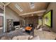 Inviting living room features a stone fireplace, skylights and stylish furnishings at 3251 Interlocken Dr, Evergreen, CO 80439