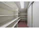 Walk-in pantry with shelving, closet and skylight at 3251 Interlocken Dr, Evergreen, CO 80439
