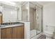 Modern bathroom with tiled shower, updated vanity, and contemporary fixtures at 1495 Vrain St # 115, Denver, CO 80204