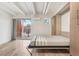 Convertible bedroom with a built in Murphy bed, balcony and wood floors at 1495 Vrain St # 115, Denver, CO 80204