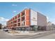 Exterior view of the Circa West building showcasing its modern architecture, balconies, and prime corner location at 1495 Vrain St # 115, Denver, CO 80204