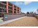 Exterior view of community dog run with ample space for pets to play, surrounded by a secure brick wall at 1495 Vrain St # 115, Denver, CO 80204