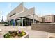 Exterior facade of a Starbucks Coffee location features outdoor seating, modern design, and access at 1495 Vrain St # 115, Denver, CO 80204