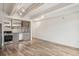 Modern kitchen with stainless steel appliances, light wood cabinetry, and a sleek countertop at 1495 Vrain St # 115, Denver, CO 80204