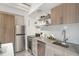 Well-equipped kitchen with stainless steel appliances, ample cabinetry, and a stylish backsplash at 1495 Vrain St # 115, Denver, CO 80204