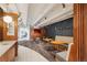 Modern community lobby features seating, decorative walls and lights, and unique flooring design throughout at 1495 Vrain St # 115, Denver, CO 80204