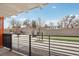 Outdoor patio area surrounded by trees, with modern seating arrangements at 1495 Vrain St # 115, Denver, CO 80204