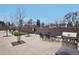 Inviting outdoor patio with dining table, chairs, and a stainless steel grill, perfect for entertaining at 1495 Vrain St # 115, Denver, CO 80204