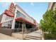 Restaurant exterior boasts architectural facade with seating, open entrance, and sidewalk access at 1495 Vrain St # 115, Denver, CO 80204