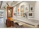 Contemporary kitchen/sitting area complete with counter, seating, and curated art gallery wall at 1495 Vrain St # 115, Denver, CO 80204