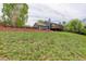Expansive backyard featuring a well-maintained lawn, privacy fence, and a charming two-story home with a deck at 5861 S Orleans Way, Centennial, CO 80015