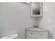 Bathroom featuring a corner sink with granite countertops and storage at 5861 S Orleans Way, Centennial, CO 80015