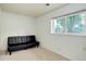 Bedroom with a black futon and window overlooking the neighborhood at 5861 S Orleans Way, Centennial, CO 80015