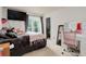 Comfortable bedroom featuring a window, walk-in closet, and vanity desk at 5861 S Orleans Way, Centennial, CO 80015