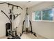 Well-lit gym space featuring workout equipment and a window for natural light at 5861 S Orleans Way, Centennial, CO 80015