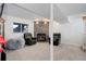 Basement with a stone fireplace, two comfortable chairs, and a cozy beanbag at 5861 S Orleans Way, Centennial, CO 80015