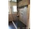 Walk-in shower featuring stylish tiling and glass enclosure at 5256 E 129Th Pl, Thornton, CO 80241
