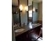 Bathroom featuring double sinks, granite countertops, and modern lighting fixtures at 5256 E 129Th Pl, Thornton, CO 80241
