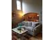 Comfortable living space featuring a large window and an archway leading to another room at 5256 E 129Th Pl, Thornton, CO 80241