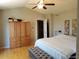 Spacious main bedroom with vaulted ceilings, ceiling fan, and ample closet space at 5256 E 129Th Pl, Thornton, CO 80241