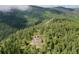 Secluded home surrounded by lush forest, offering privacy and natural beauty at 9648 Yegge Rd, Morrison, CO 80465