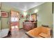 This bathroom features vessel sinks, a wooden soaking tub, and a view into the main bedroom at 9648 Yegge Rd, Morrison, CO 80465