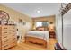 Cozy bedroom featuring rustic decor, hardwood floors and a window with beautiful view at 9648 Yegge Rd, Morrison, CO 80465