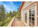 This covered deck provides beautiful views of the surrounding landscape at 9648 Yegge Rd, Morrison, CO 80465