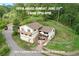 Charming multi-level home with wooden balconies and fencing, nestled in a lush, wooded area at 9648 Yegge Rd, Morrison, CO 80465