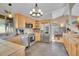 The kitchen has light wood cabinets, tile backsplash, and stainless appliances at 9648 Yegge Rd, Morrison, CO 80465