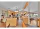 The kitchen has light wood cabinets, tile floors, breakfast bar, and an island with stainless refrigerator at 9648 Yegge Rd, Morrison, CO 80465