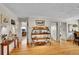 Bright living room with hardwood floors and display shelves, perfect for showcasing décor at 9648 Yegge Rd, Morrison, CO 80465
