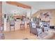Open living room with kitchen, hardwood floors, and comfortable seating at 9648 Yegge Rd, Morrison, CO 80465
