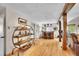 Spacious living room features hardwood floors, custom shelving, and a built-in bar area at 9648 Yegge Rd, Morrison, CO 80465