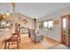 Bright living room featuring hardwood floors, large windows, and open layout at 9648 Yegge Rd, Morrison, CO 80465