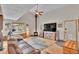 Spacious living room with a fireplace, a large TV, and comfortable seating at 9648 Yegge Rd, Morrison, CO 80465