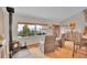 Inviting living room showcasing a wood-burning stove, large windows with views, and hardwood floors at 9648 Yegge Rd, Morrison, CO 80465